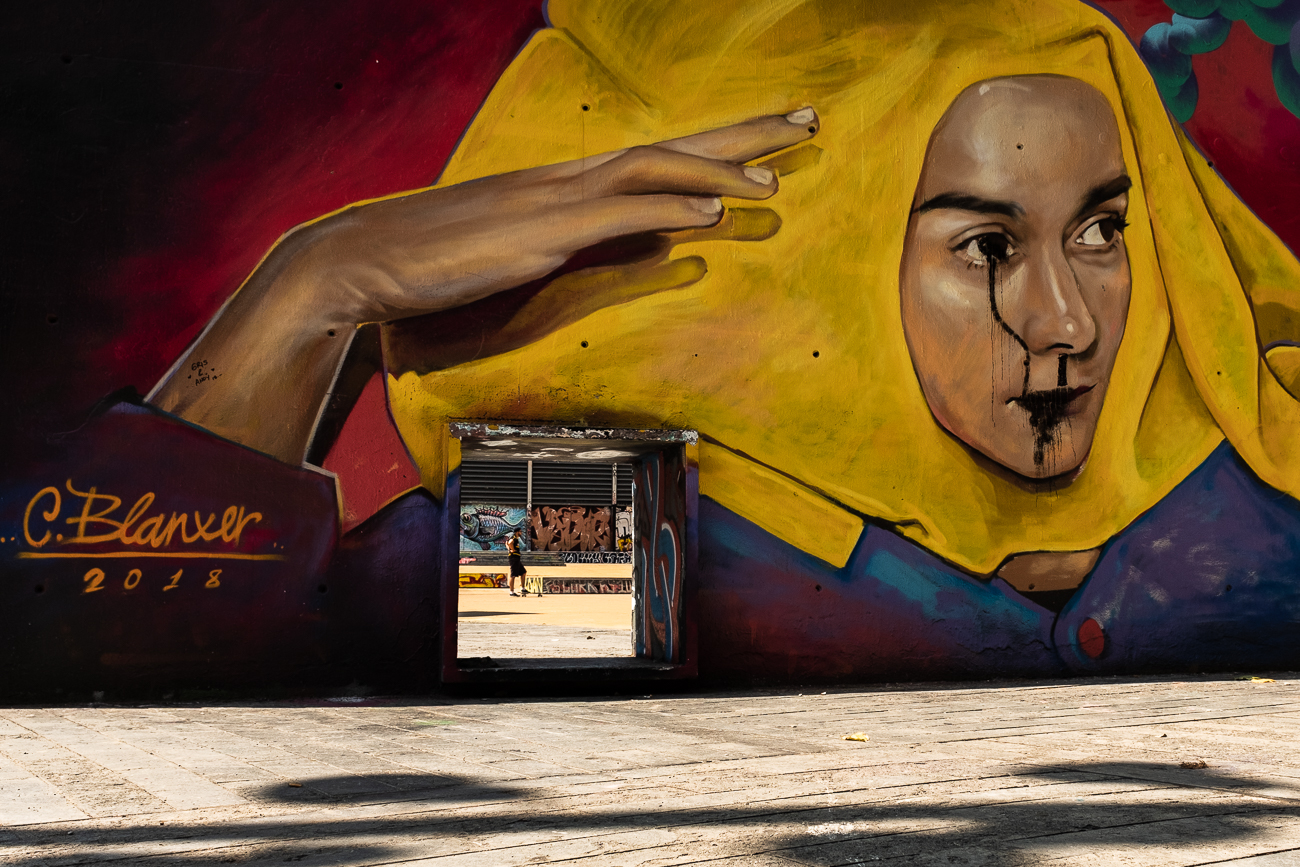A skateboarder at a grafitti park in Barcelona, Spain.